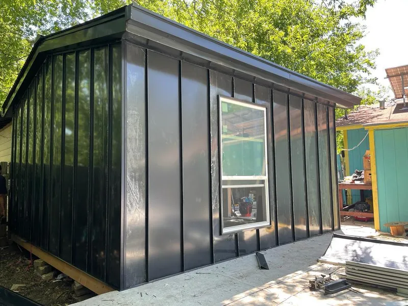 Black standing seam metal wall panels for Metal Roof Installation in Le Roy